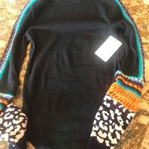 Pull over shirt, with knit inserts on the sleeves.